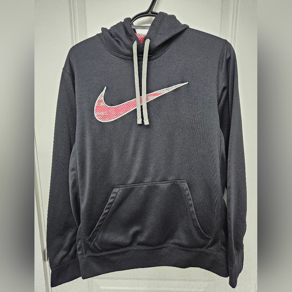 Nike Therma-Fit pullover hoodie in black with a pink/red and white swoosh logo. 